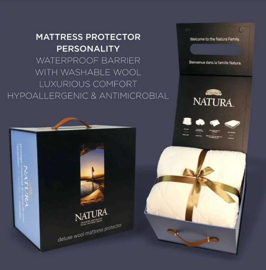 NATURA brand mattress protector gift set showing a black outer box